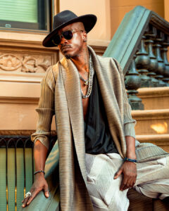 Black male on Brooklyn brownstone steps